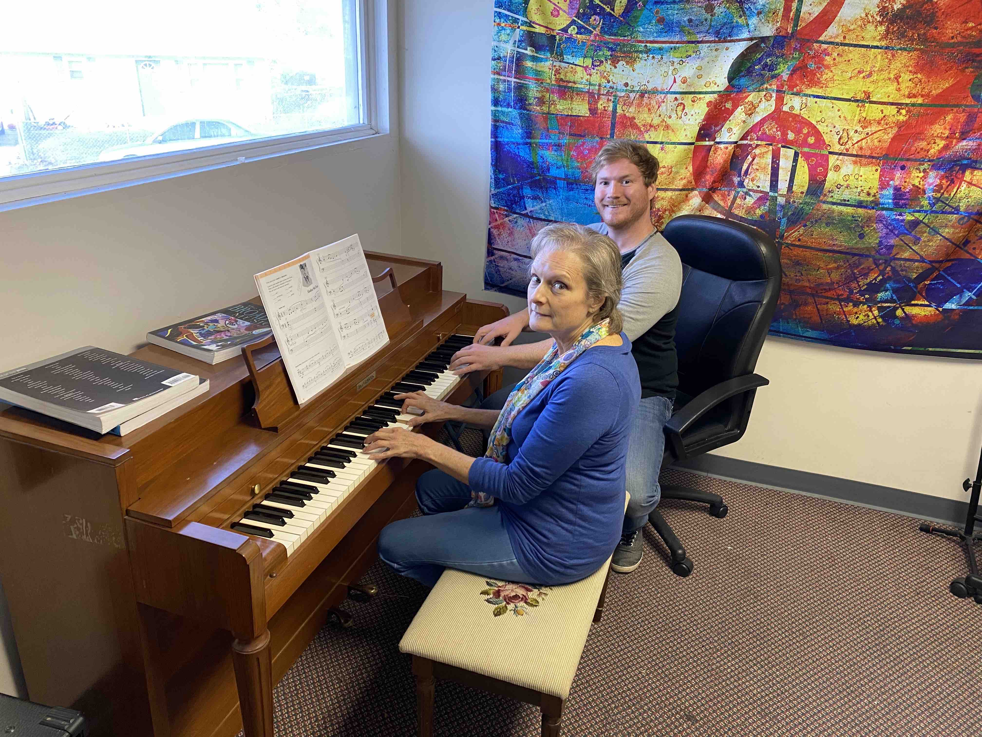 Greg teaching Piano