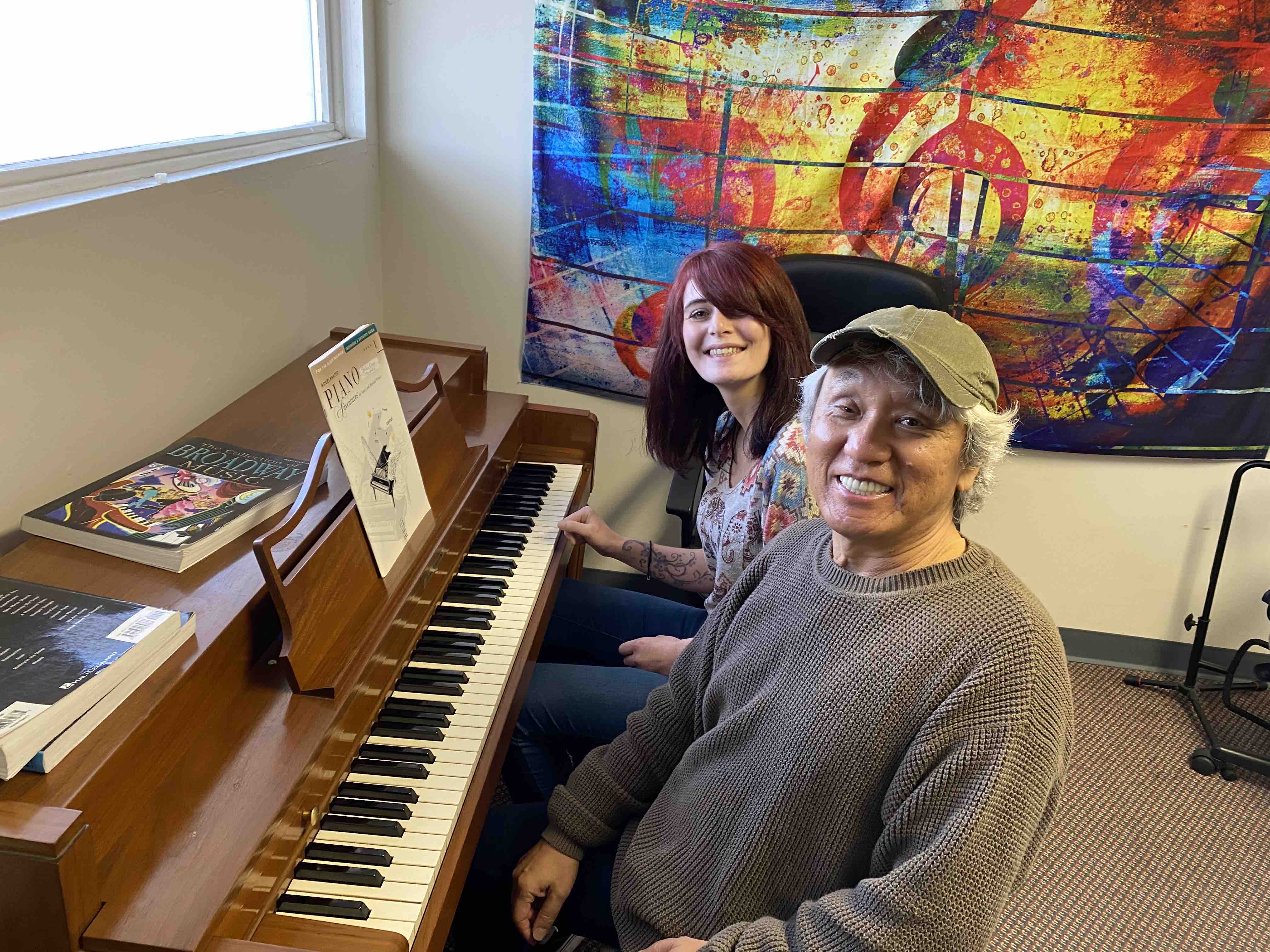 Phiya teaching a piano lesson